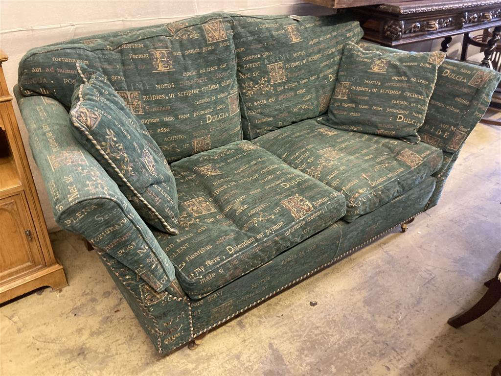 A modern contemporary upholstered two seater sofa upholstered in patterned green fabric, length 178cm, depth 97cm, height 78cm